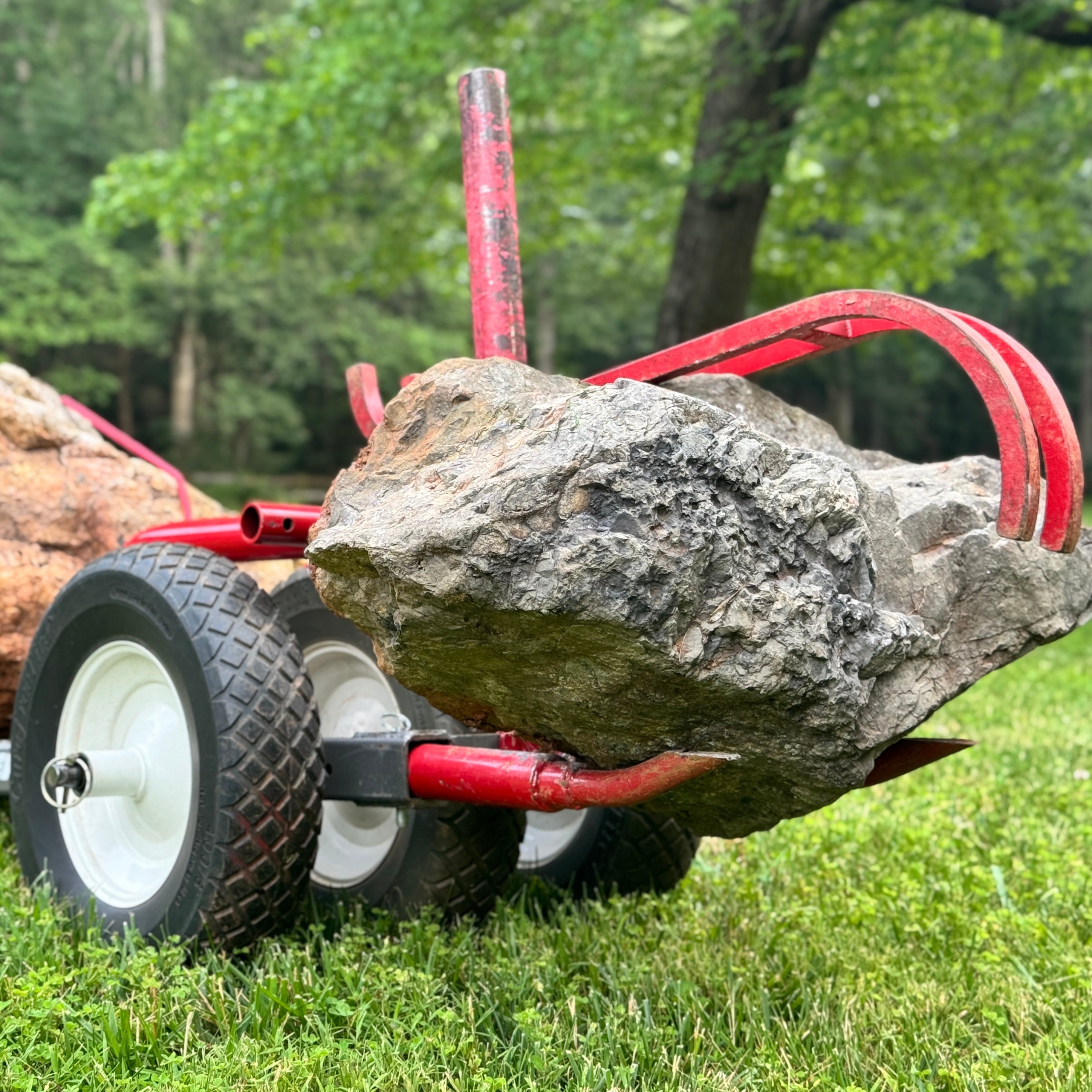 Rhino Tool System loaded with large gray stone