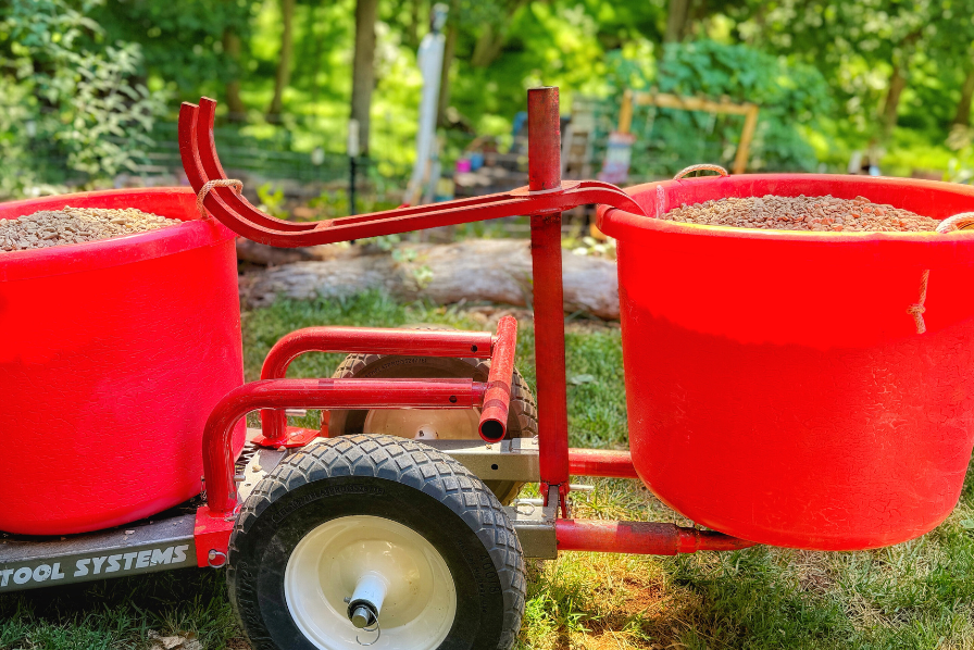 Rhino Tool Systems rock hauler carrying two buckets of stone wheelbarrow alternative
