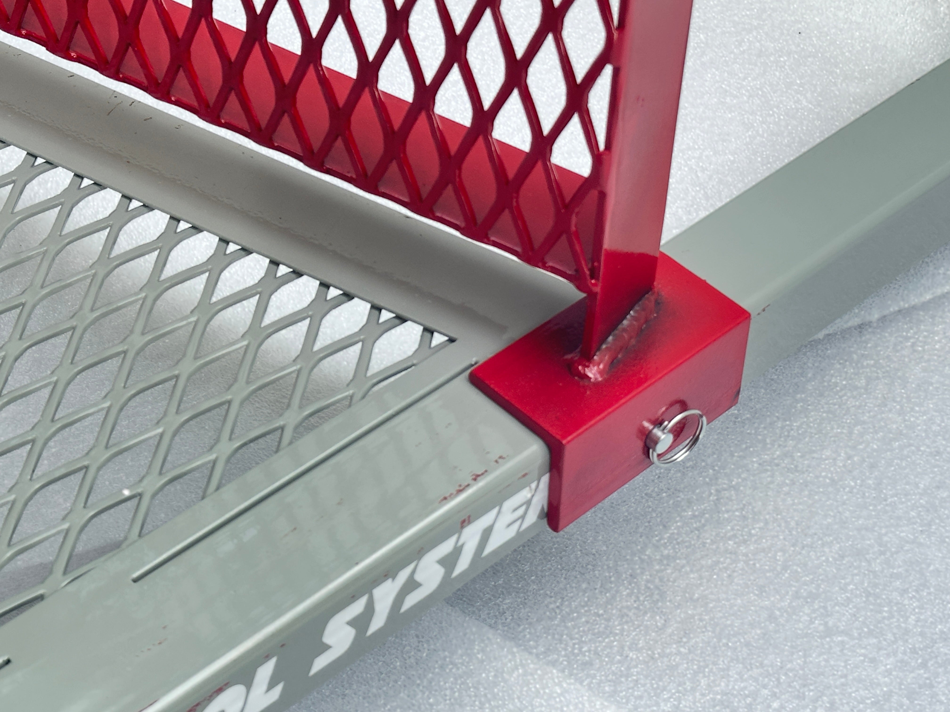 Metal support brace pinned into metal tubing