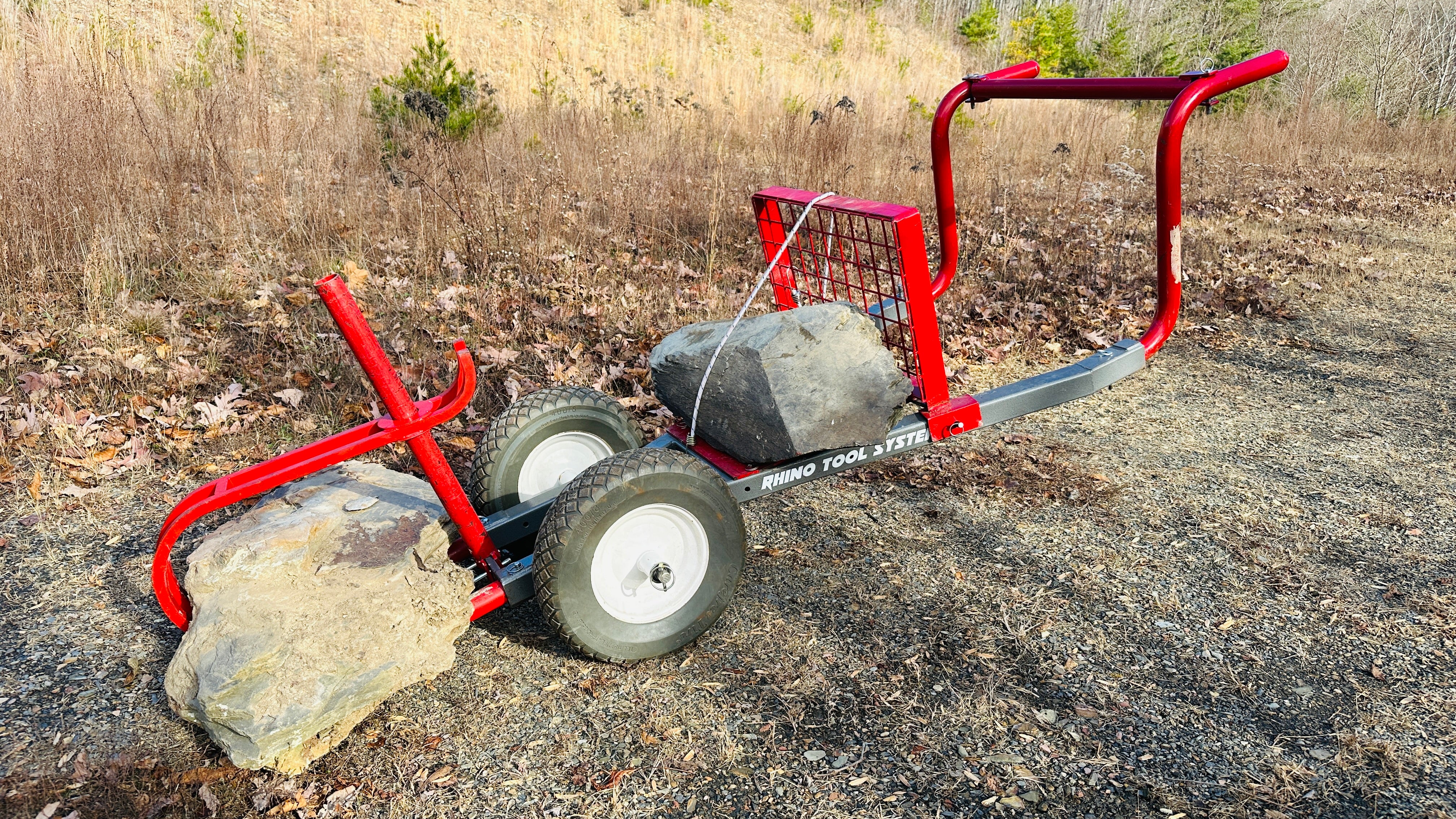 Rock sheriff yard cart loaded with big stones Rhino Tool Systems