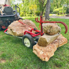 Rhino Tool System loaded with stone attached to lawn mower
