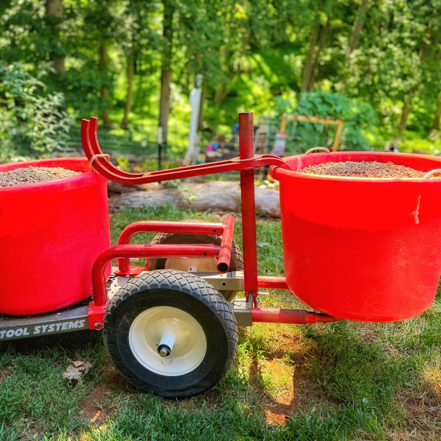 Rhino Tool Systems rock hauler carrying two buckets of stone wheelbarrow alternative