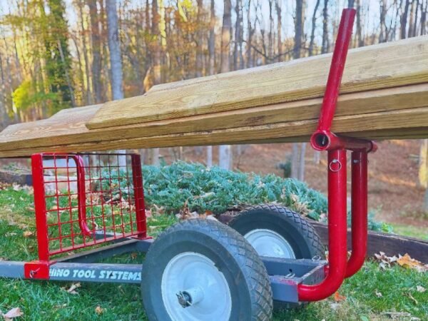 Lumber Hauler yard cart with expanded steel Back mesh and upright posts supporting lumber
